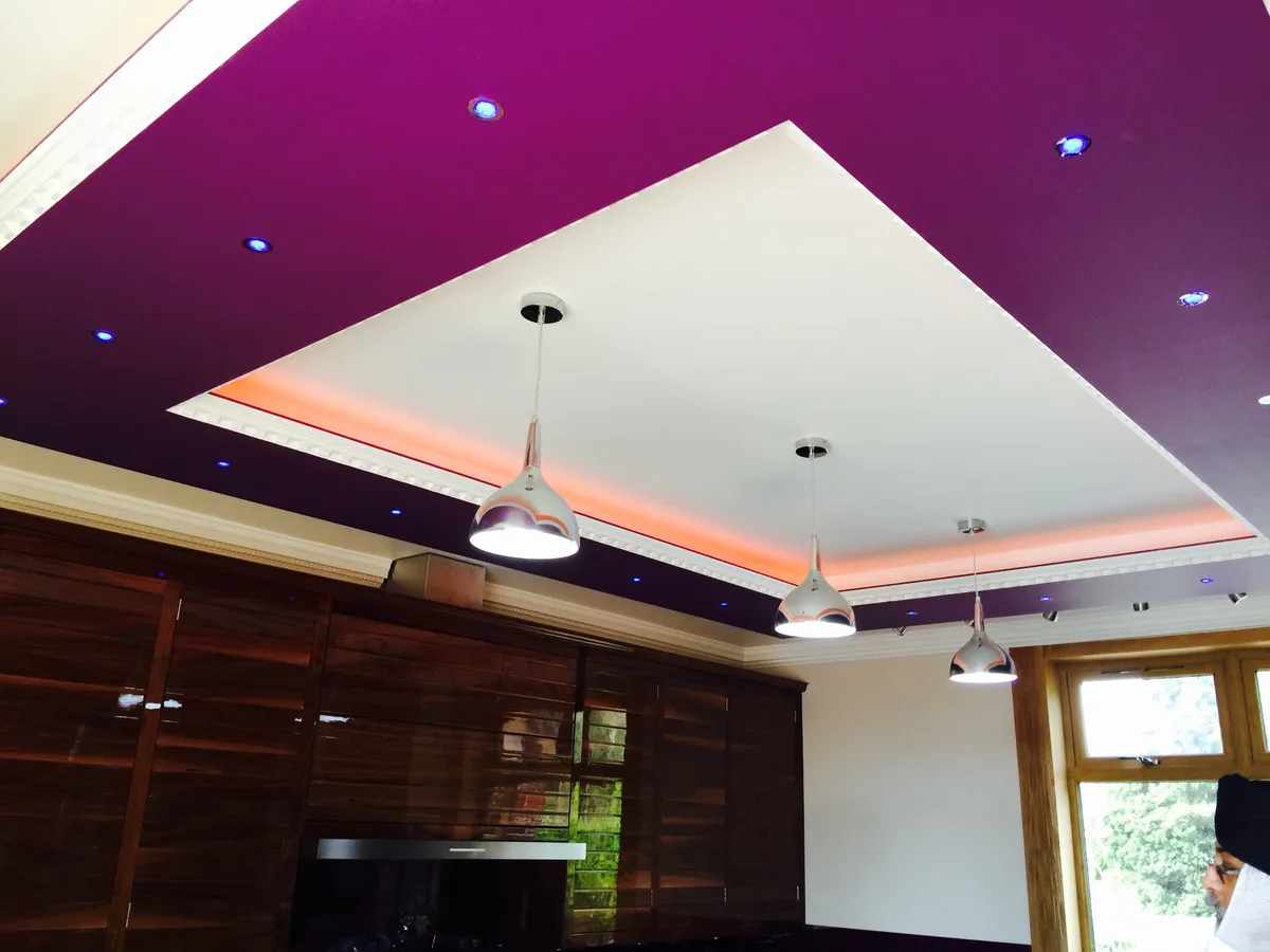 Stepped ceiling with LED cove lighting and pendant lights installed in a Berkshire kitchen