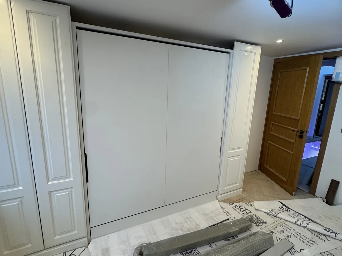 Painted bespoke wardrobes with shaker doors in an Ascot property
