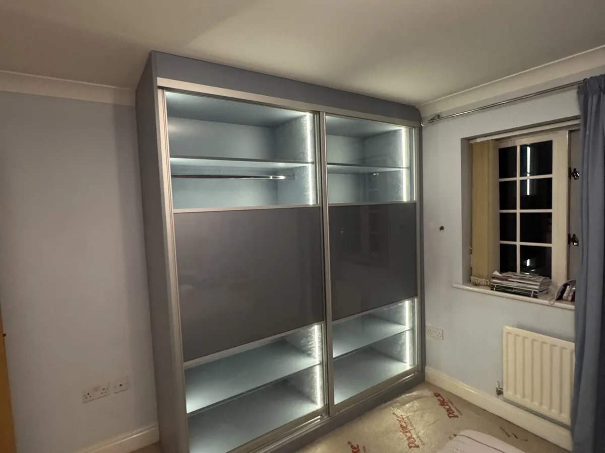Custom floor-to-ceiling wardrobes with integrated lighting in Ascot