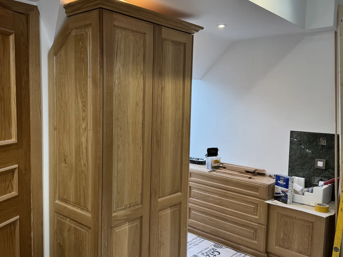 Custom fitted wardrobes with LED lighting in a Bracknell bedroom