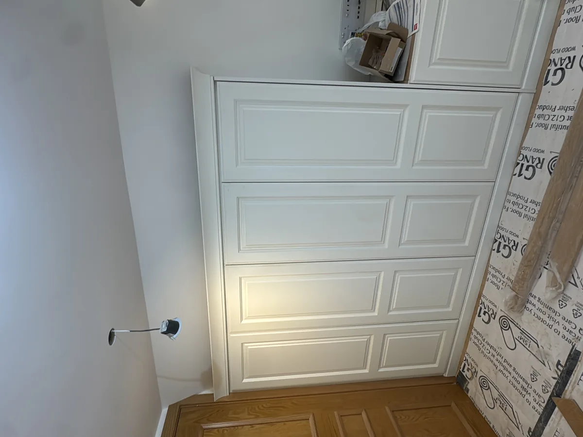 Bespoke fitted wardrobes installed floor-to-ceiling in an Ascot bedroom