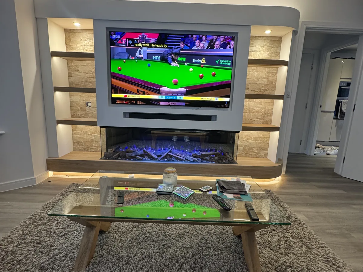 Custom bespoke media wall with integrated electric fireplace in Ascot, Berkshire