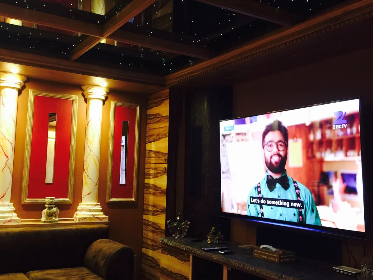 Bespoke media wall with TV alcove and floating shelves in an Bracknell, Berkshire living room