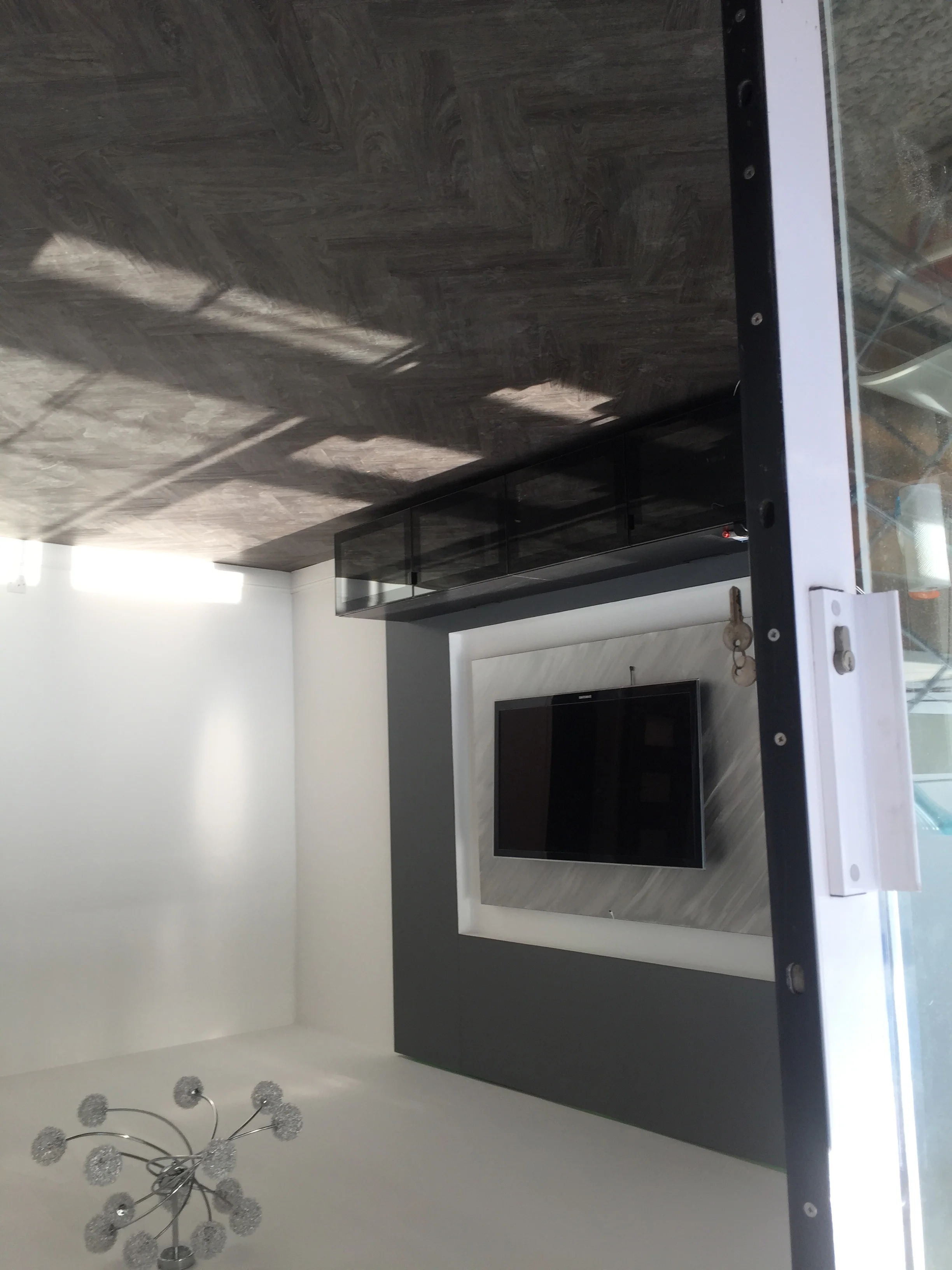 Media wall with marble TV alcove panel in a Berkshire living room