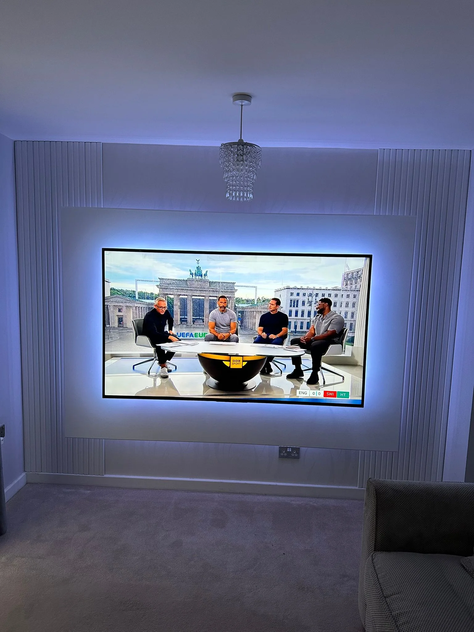 TV media wall with LED backlight panel in a Berkshire living room
