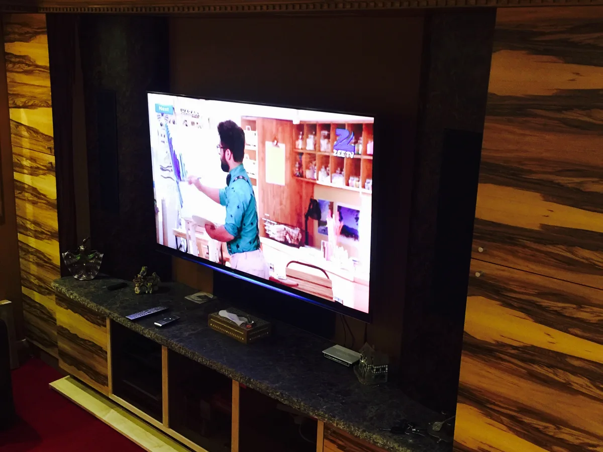 Bespoke TV wall unit with integrated shelving in an Ascot living room