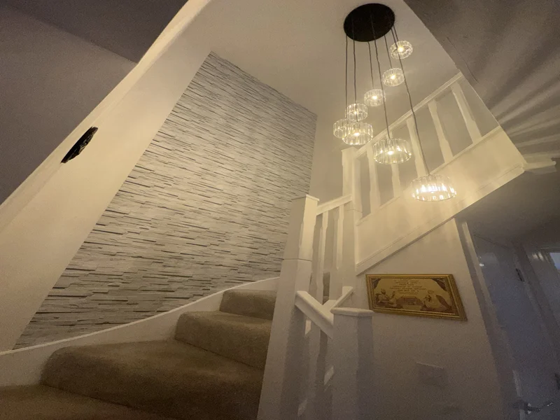 Painted balustrade staircase upgrade with new newel posts in a Berkshire home