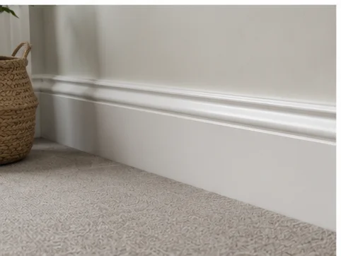 Deep white skirting board fitted against carpet in a Berkshire hallway