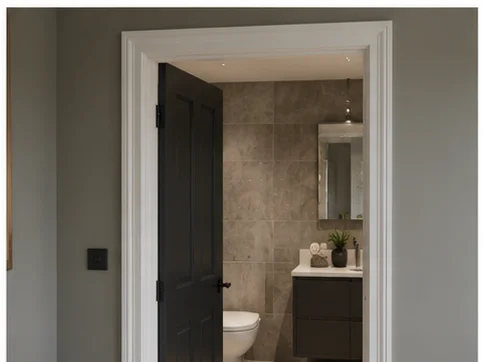 White painted architrave framing a dark internal door in a Berkshire home