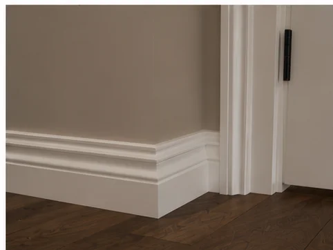White skirting board precisely fitted against tiled floor in a Berkshire bathroom