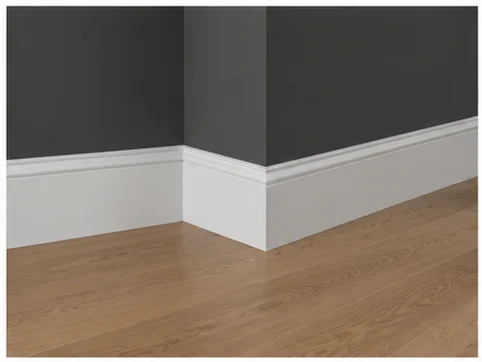 White torus profile skirting board and cornice in a grey room in Berkshire